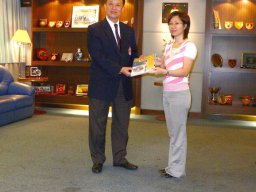 Member  receiving a  first aid hand book